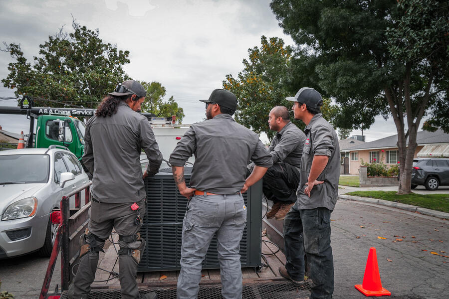 Apex crew watching a unit lift on site