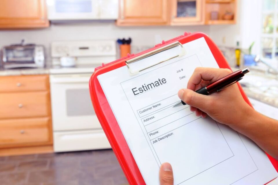 Professional remodeler writing an estimate for a kitchen renovation project